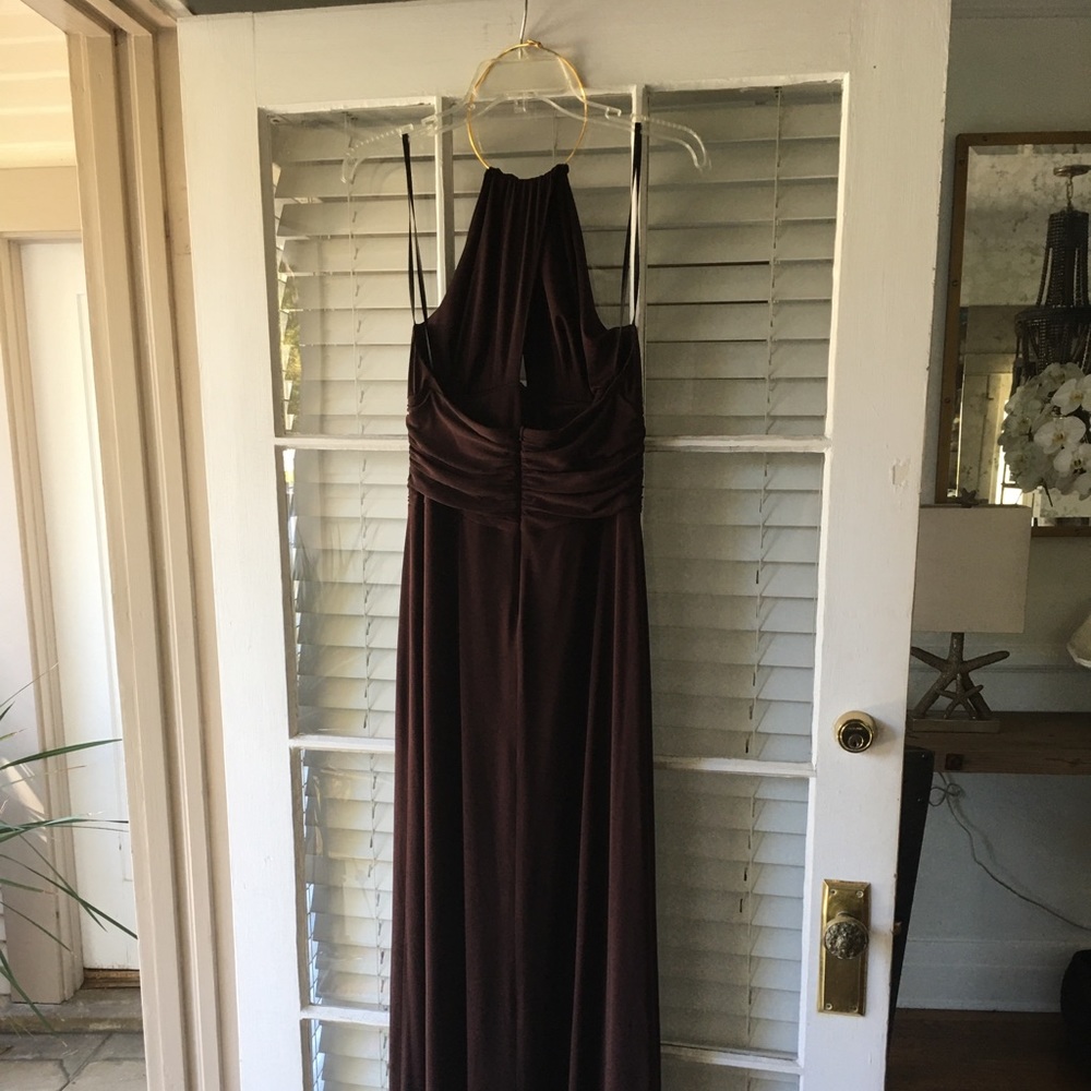 Long brown gown with gold necklace